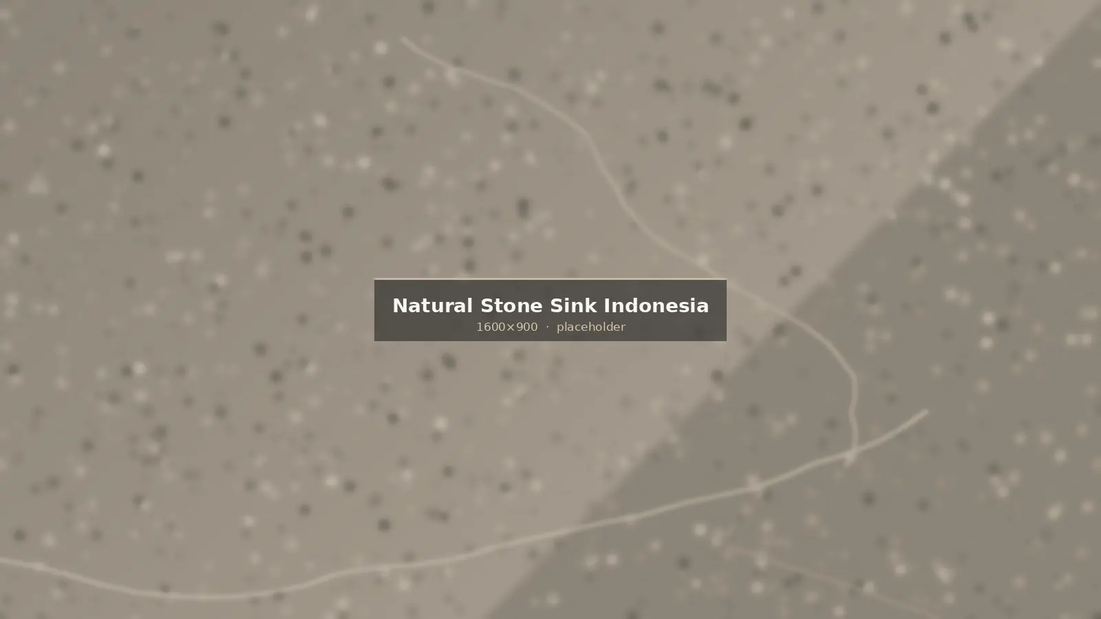 Carved natural stone vessel sink made from Indonesian river stone